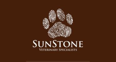 SunStone Veterinary Specialists logo with a stylized paw print on a brown background.